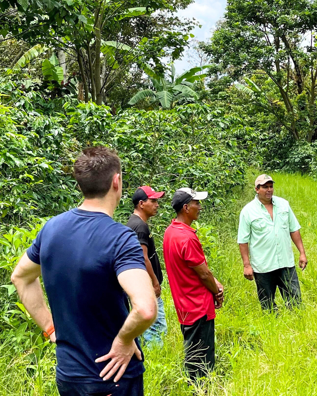 Grant Lang standing with other men from the coffee farming community in Nicaragua