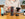 A lady placing the AeroPress on a table with ground coffee