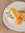 A coffee and carrot cake cocktail with a carrot cake next to it