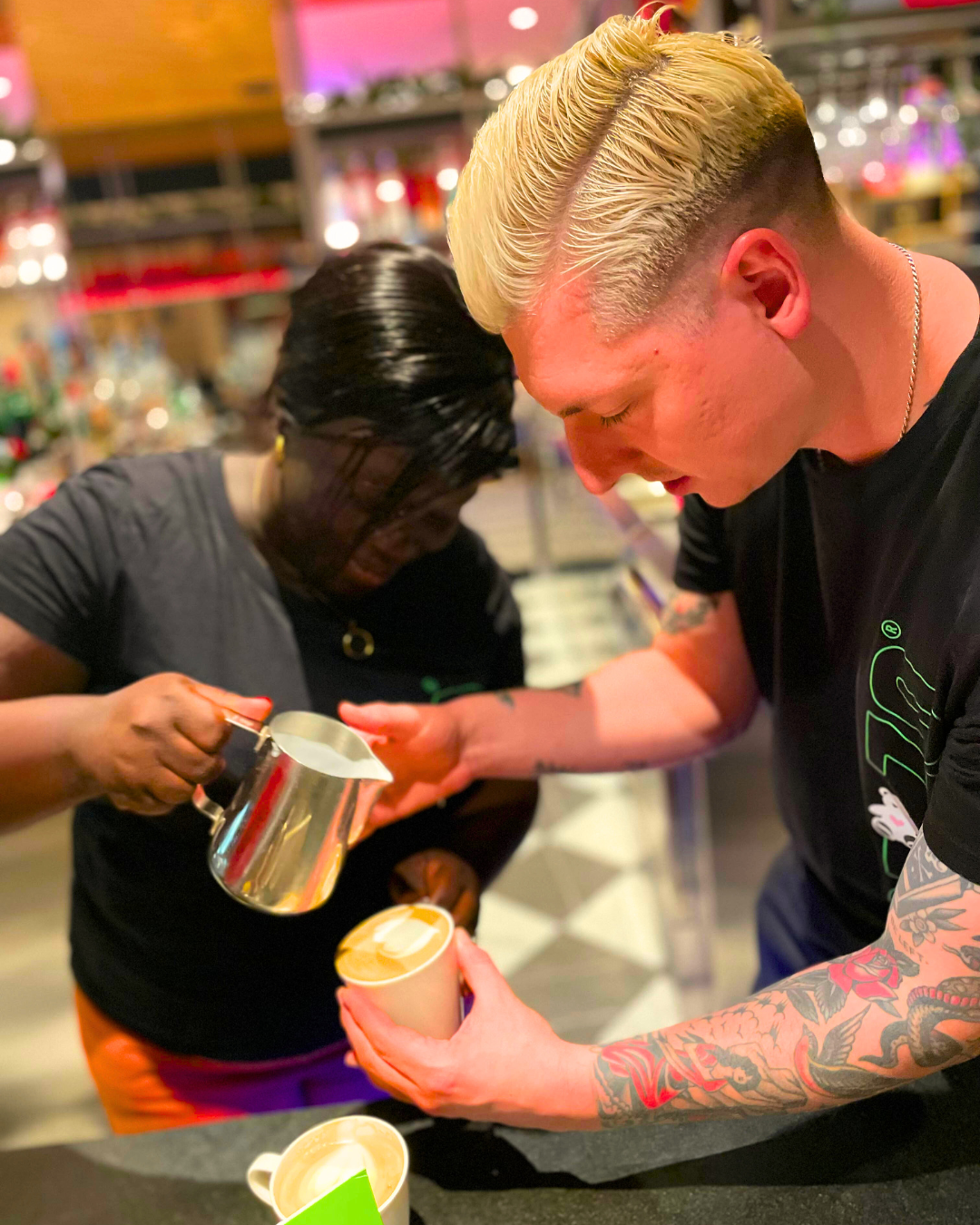 Mozzo coffee professionals making latte art 