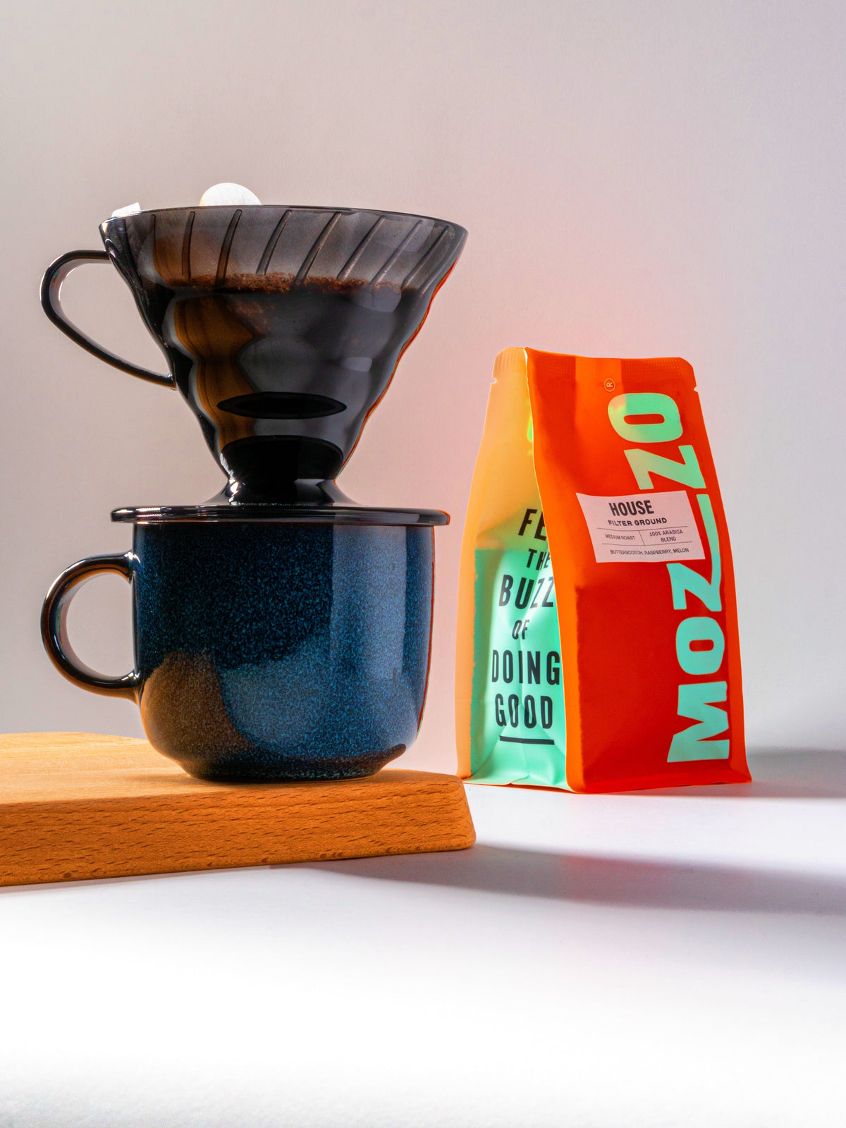 A V60 filter coffee with mug and Mozzo coffee 